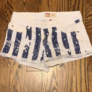 White and blue Flag jean shorts